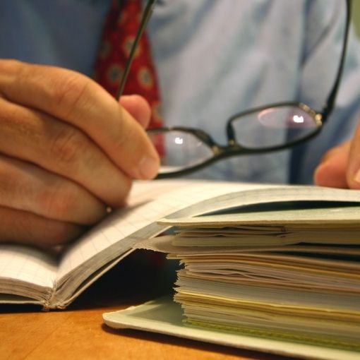 Man with glasses reading